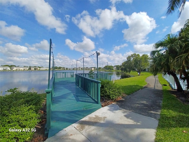 3437 NW 44th St Unit 102, Oakland Park, FL 33309 - surrounding community featuring a water view and a lawn