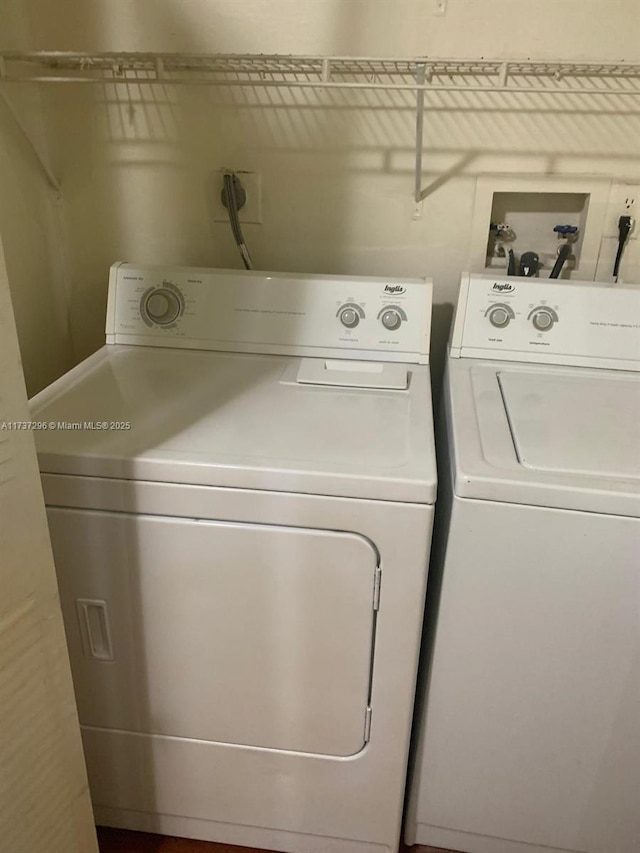 laundry area featuring washing machine and dryer