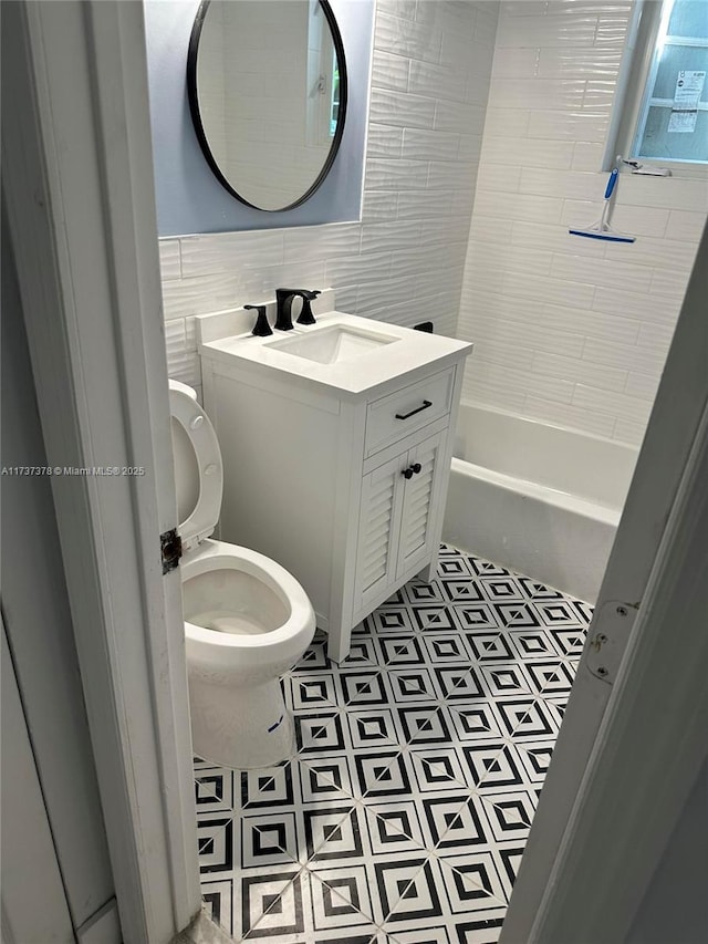 359 Meridian Ave Unit A207, Miami Beach, FL 33139 - full bath featuring vanity, tile walls, and bathtub / shower combination