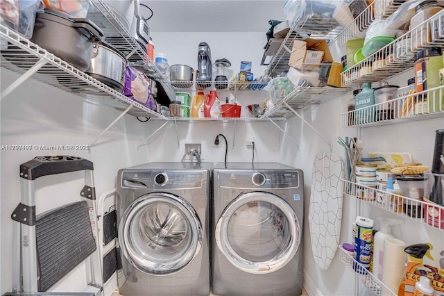 washroom featuring independent washer and dryer