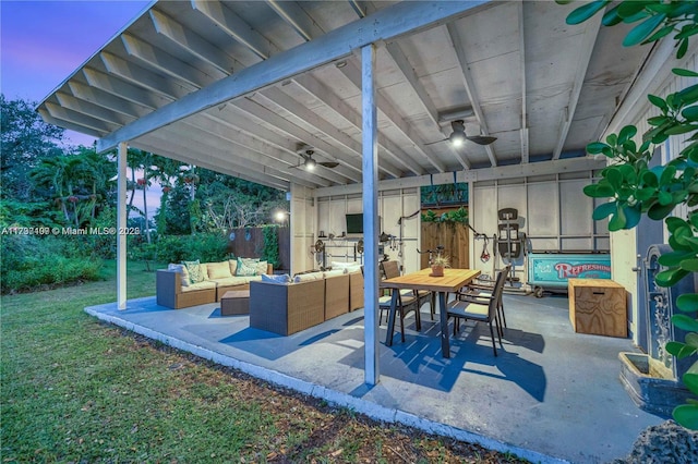 patio terrace at dusk featuring outdoor lounge area and ceiling fan