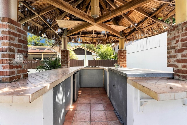 view of patio with a gazebo and fence