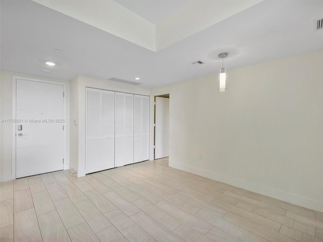 interior space with light hardwood / wood-style floors and a closet