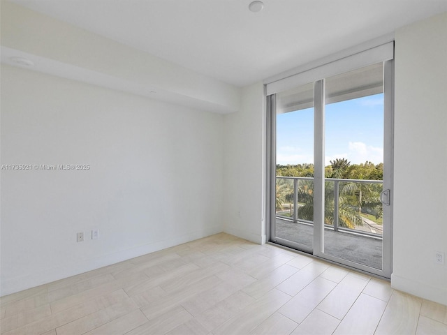 spare room with floor to ceiling windows