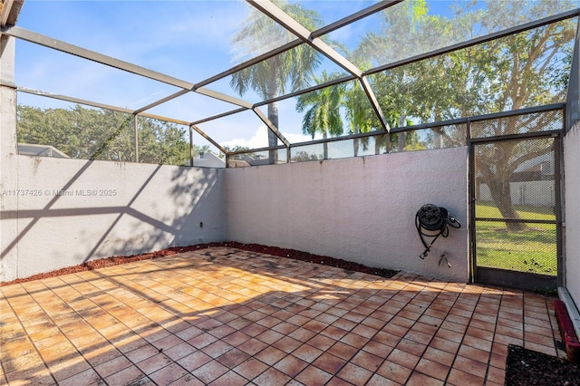 view of patio / terrace with a lanai