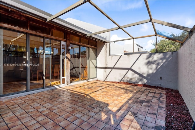 view of patio with a lanai