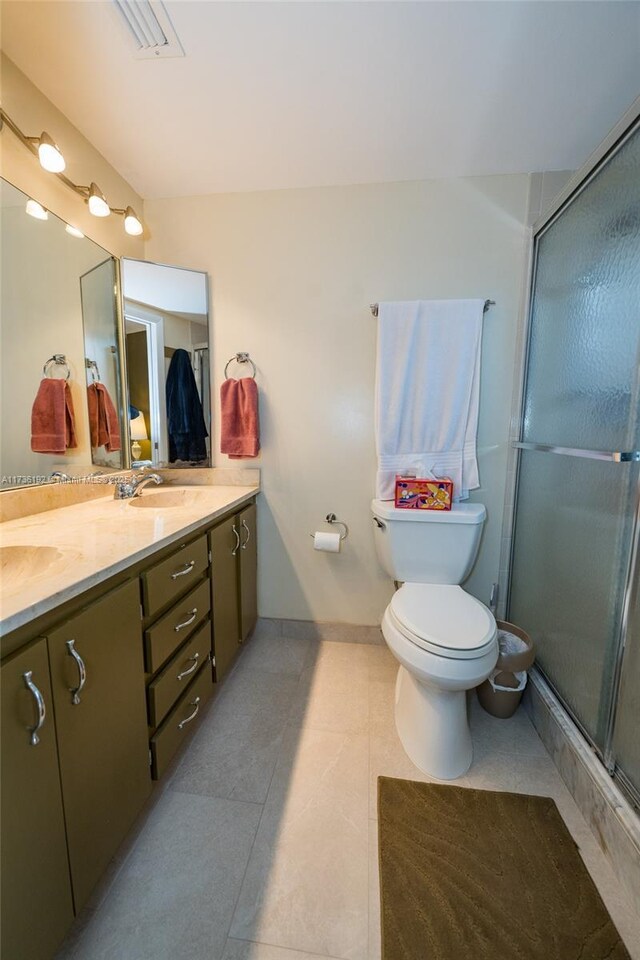 6619 Burning Wood Dr Unit 274, Boca Raton, FL 33433 - full bath featuring tile patterned floors, a stall shower, double vanity, toilet, and baseboards