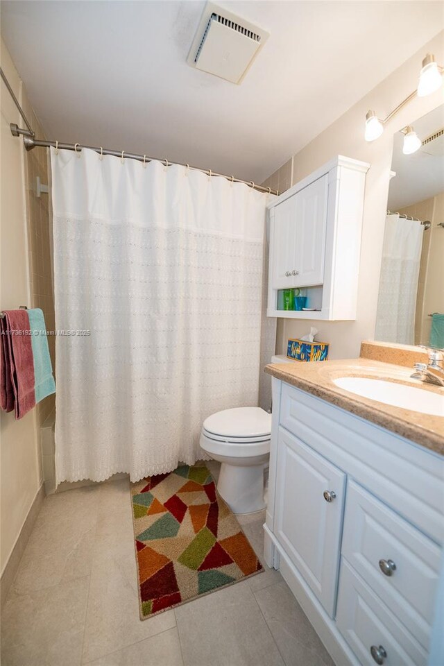 6619 Burning Wood Dr Unit 274, Boca Raton, FL 33433 - bathroom with tile patterned floors, vanity, toilet, and a shower with shower curtain