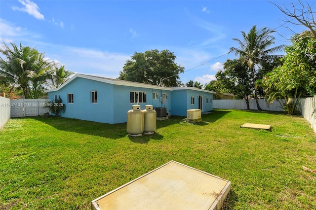 view of yard featuring central air condition unit