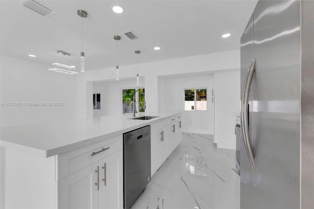 kitchen featuring sink, white cabinetry, hanging light fixtures, black dishwasher, and stainless steel refrigerator with ice dispenser