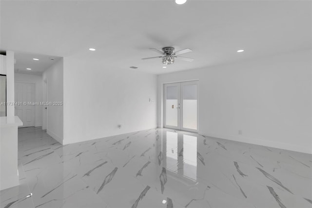 spare room with french doors and ceiling fan