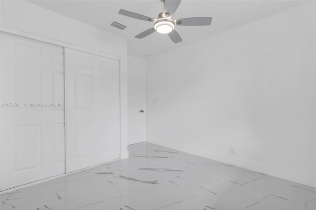 unfurnished bedroom with a closet and ceiling fan