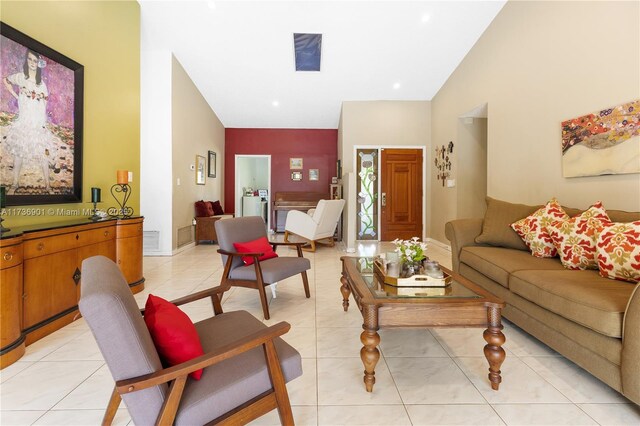 living room featuring light tile patterned flooring and high vaulted ceiling