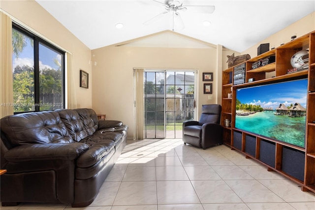 living room with vaulted ceiling, light tile patterned floors, and ceiling fan