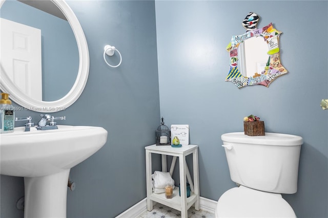 bathroom featuring sink and toilet