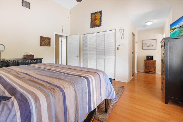 bedroom featuring hardwood / wood-style floors and a closet