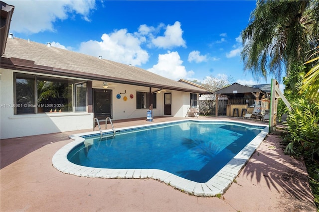 view of swimming pool with a patio area