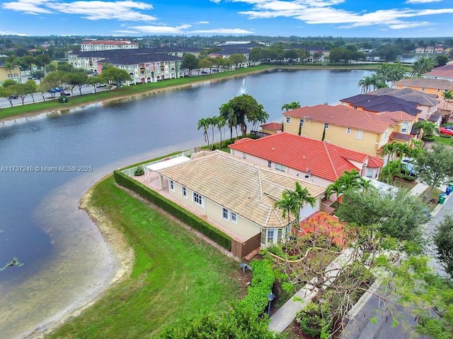 drone / aerial view with a water view