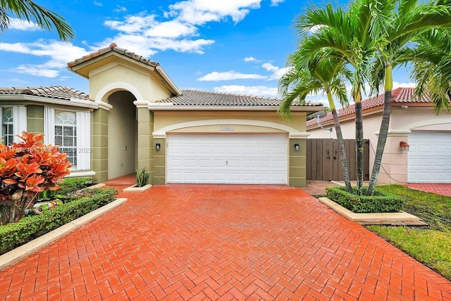 mediterranean / spanish-style home with a garage