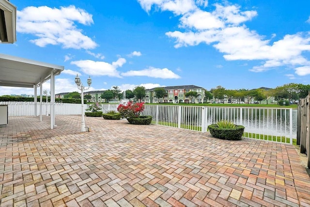 view of patio featuring a water view