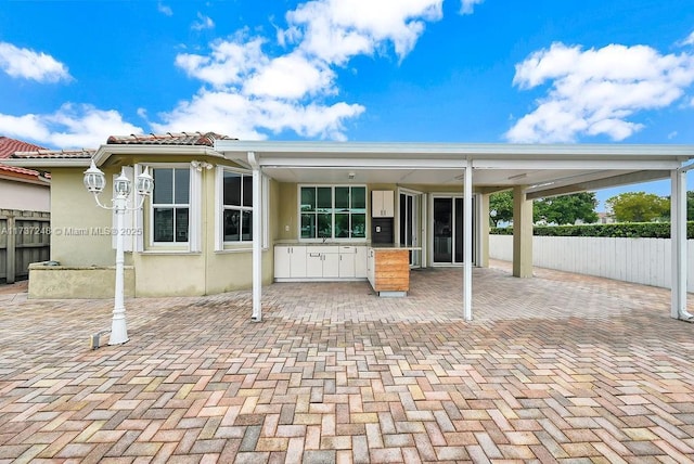 rear view of property with a patio area