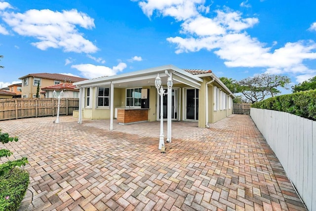 rear view of house with a patio