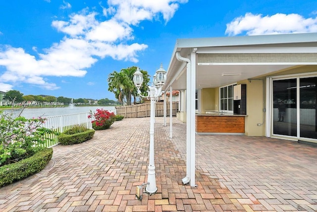 view of patio / terrace featuring a water view