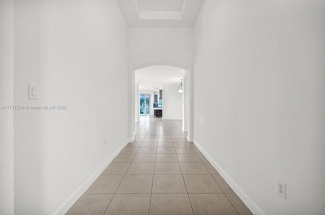 corridor featuring light tile patterned floors