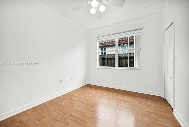 unfurnished room featuring hardwood / wood-style flooring, ornamental molding, and ceiling fan