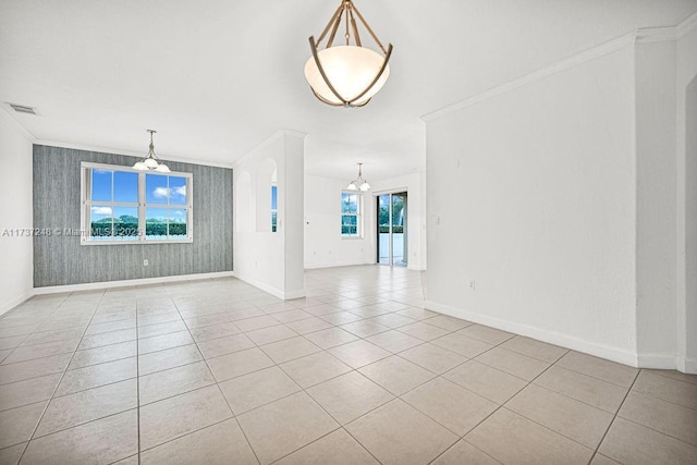 unfurnished living room featuring ornamental molding, light tile patterned floors, and a chandelier