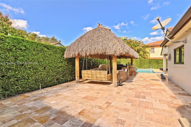 view of patio featuring a gazebo and outdoor lounge area