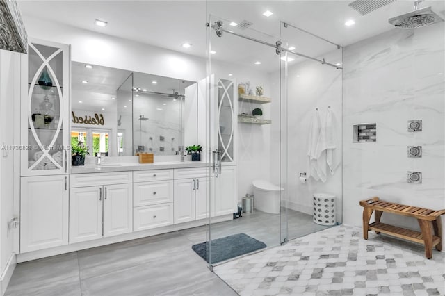 bathroom with vanity and walk in shower