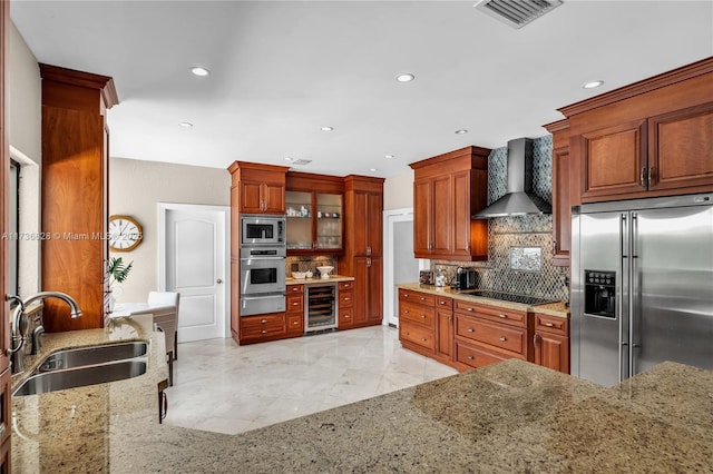 kitchen featuring wall chimney exhaust hood, sink, appliances with stainless steel finishes, beverage cooler, and decorative backsplash