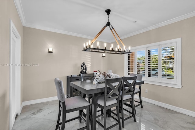 dining space with ornamental molding and a notable chandelier