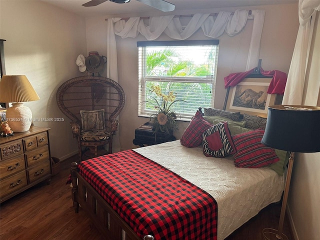 bedroom with ceiling fan and dark hardwood / wood-style flooring