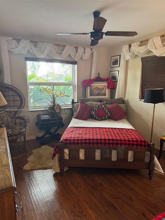 bedroom featuring dark wood-type flooring and ceiling fan