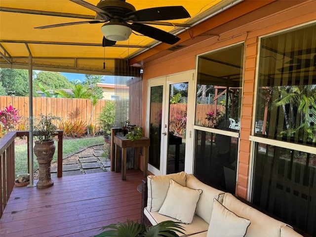 sunroom / solarium with a wealth of natural light and ceiling fan