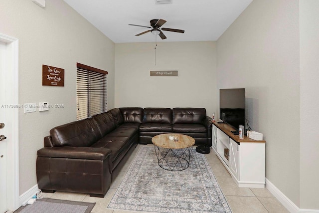 living room featuring light tile patterned floors and ceiling fan