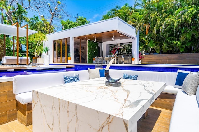 view of pool featuring ceiling fan