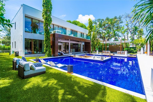 view of pool featuring a yard, a patio, and an in ground hot tub