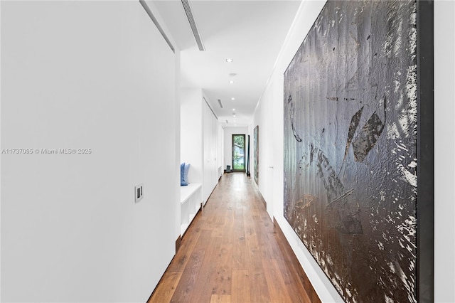 hallway featuring wood-type flooring