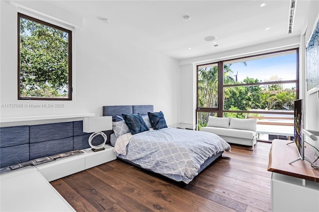 bedroom with hardwood / wood-style floors