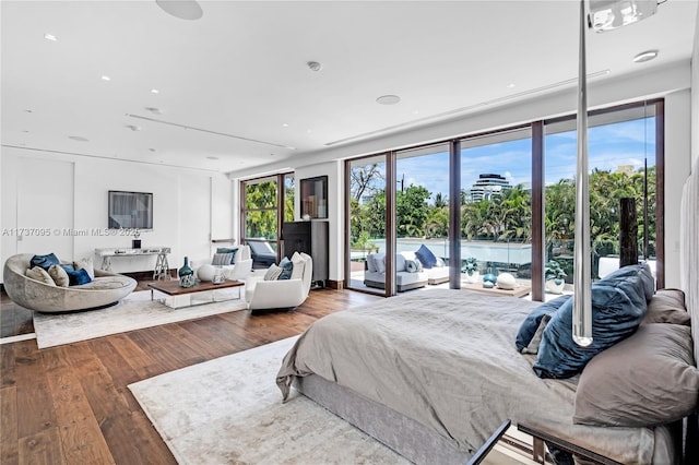 bedroom featuring dark wood-type flooring and access to outside