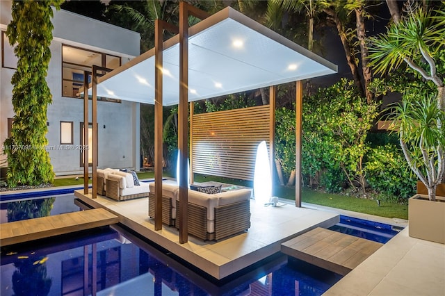 view of swimming pool featuring an outdoor living space and an in ground hot tub