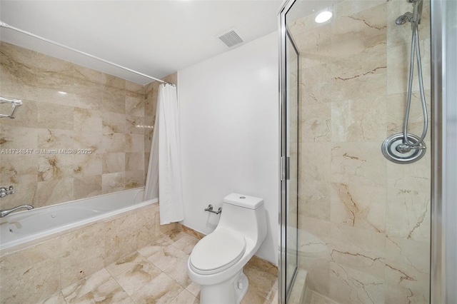 bathroom featuring shower / bath combo and toilet