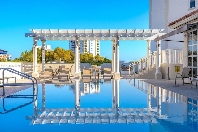 view of pool featuring a pergola and a patio area