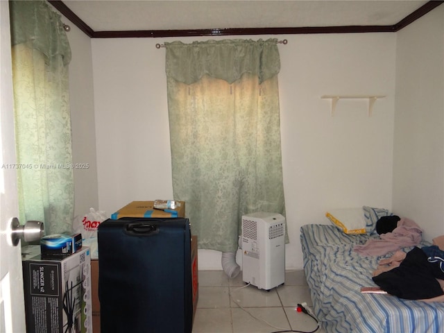 bedroom with ornamental molding and light tile patterned flooring