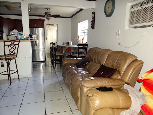 tiled living room featuring a wall mounted air conditioner and ceiling fan