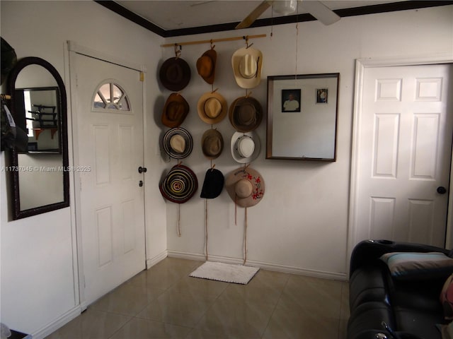 tiled foyer entrance featuring ceiling fan