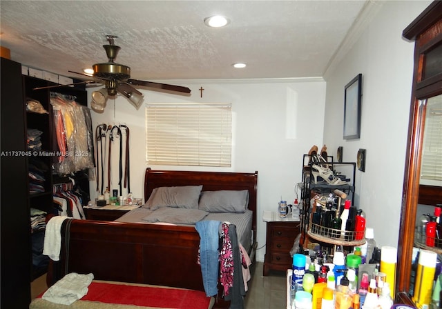 bedroom with ornamental molding and a textured ceiling